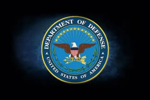 U.S. Department of Defense seal with eagle and shield.