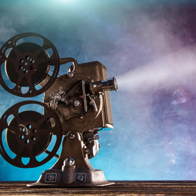Innovative Technology Film Projector | i3solutions High-quality vintage film projector with reels and light beam.