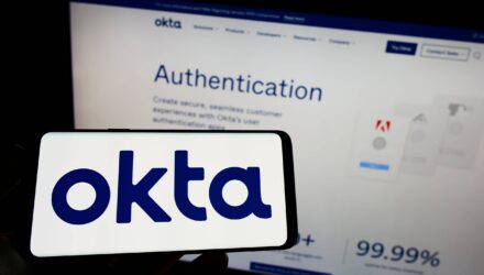 Okta Enterprise Identity Management | i3solutions Okta logo in front of Okta authentication webpage on a computer screen.