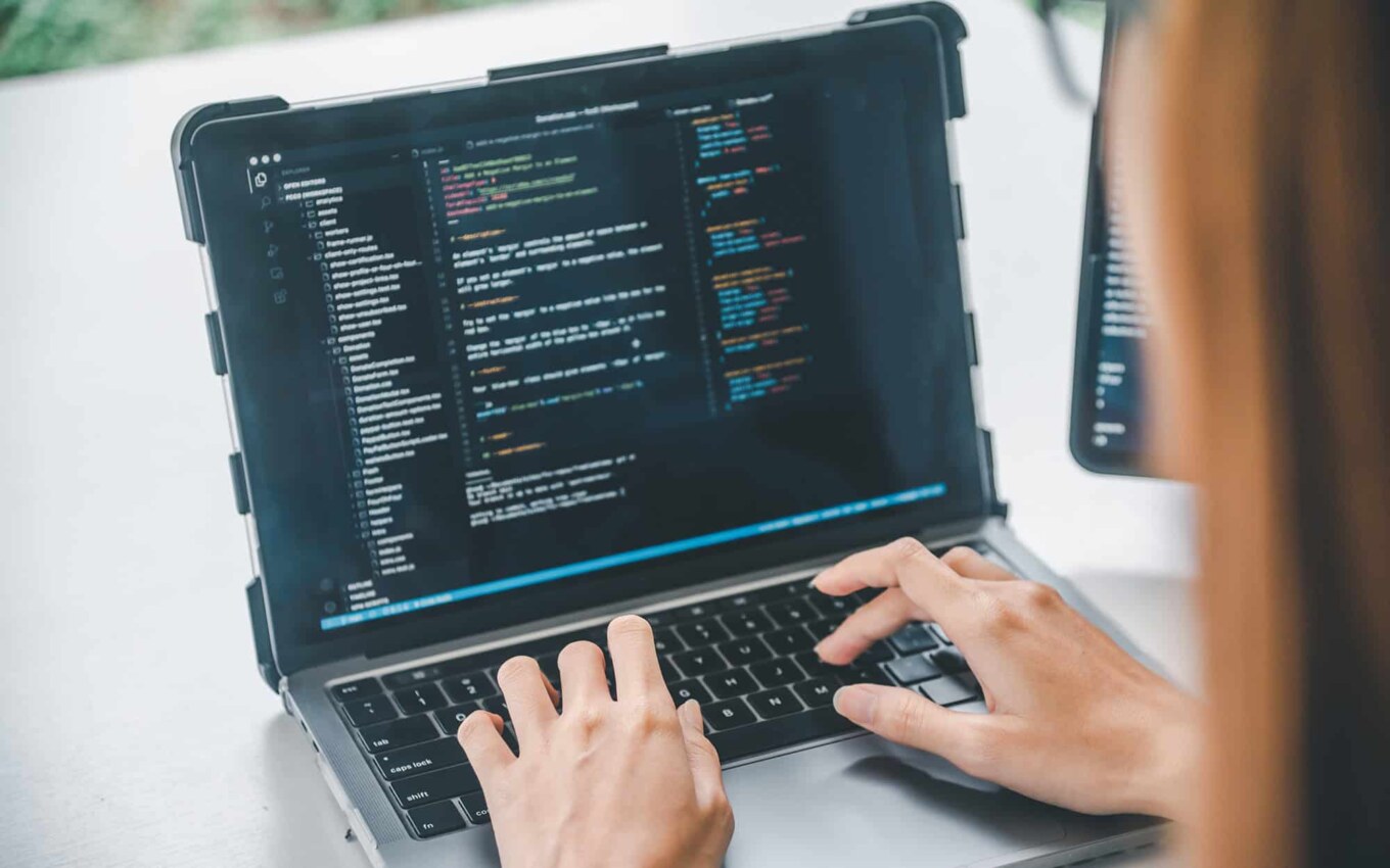 Female programmer working on coding software development and web design