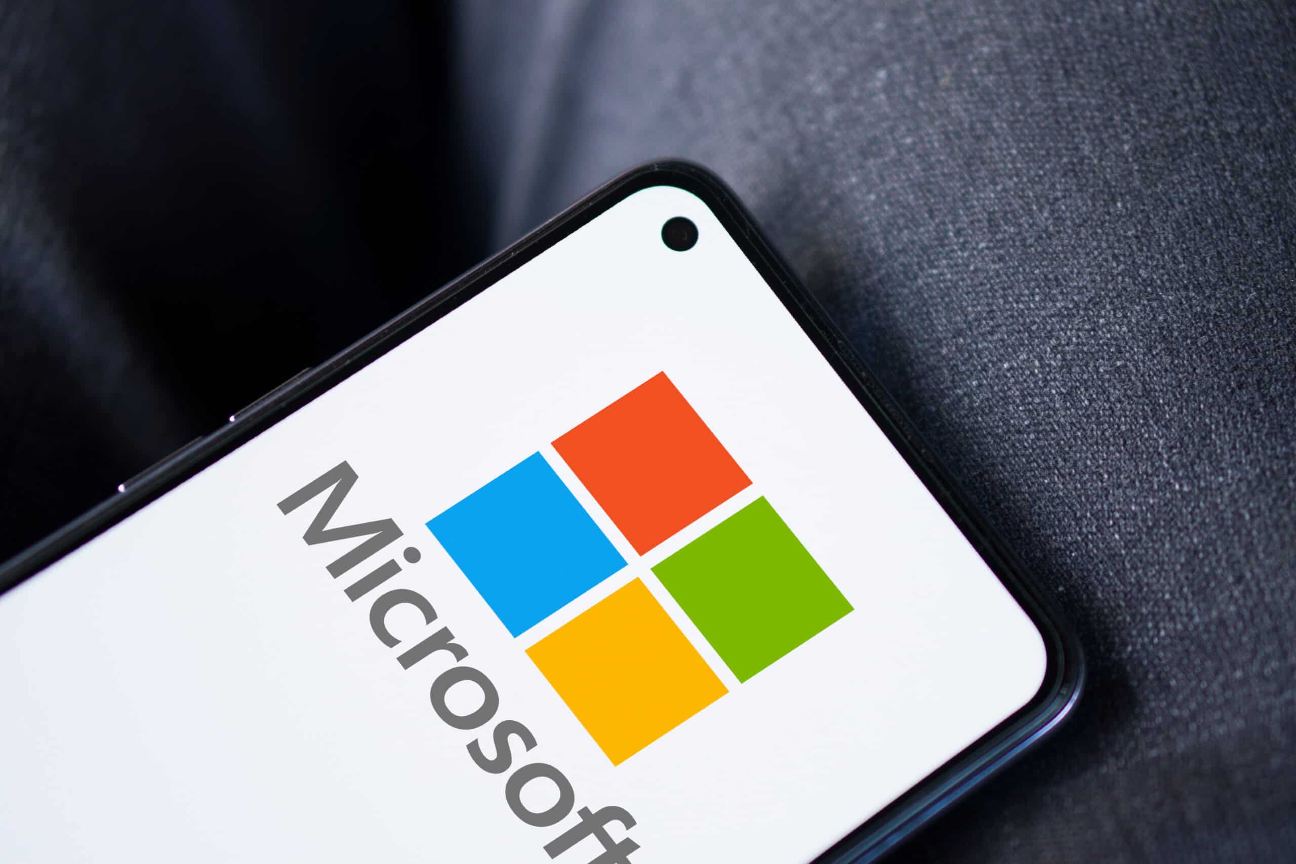 Microsoft Technologies for Business Solutions | i3solutions Microsoft logo on a smartphone screen, highlighting technology solutions.