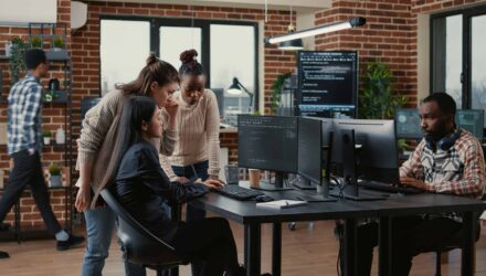 Innovative Software Development Team | i3solutions Diverse software developers collaborating in a modern office environment.