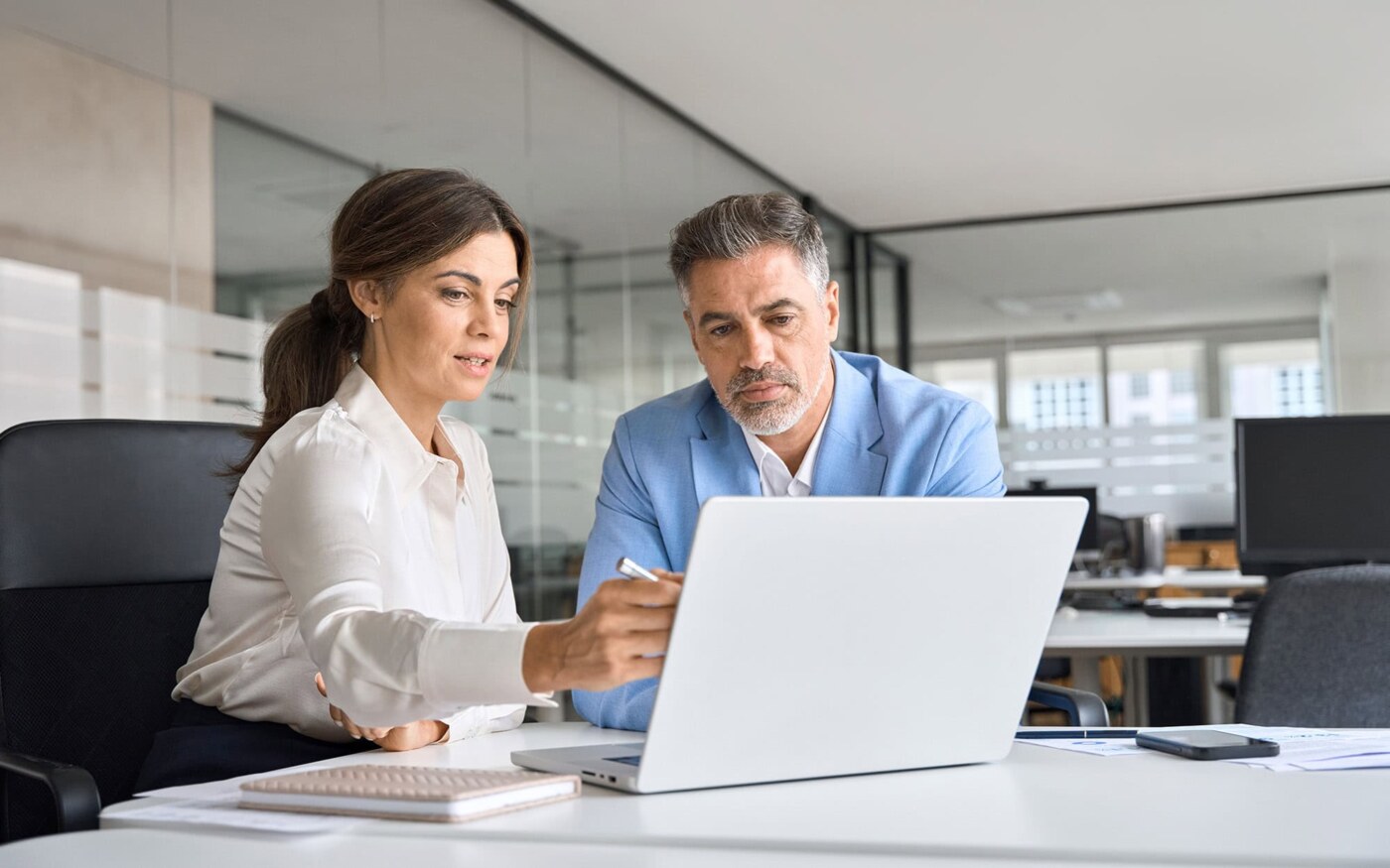 Two busy professional executive team business people working together