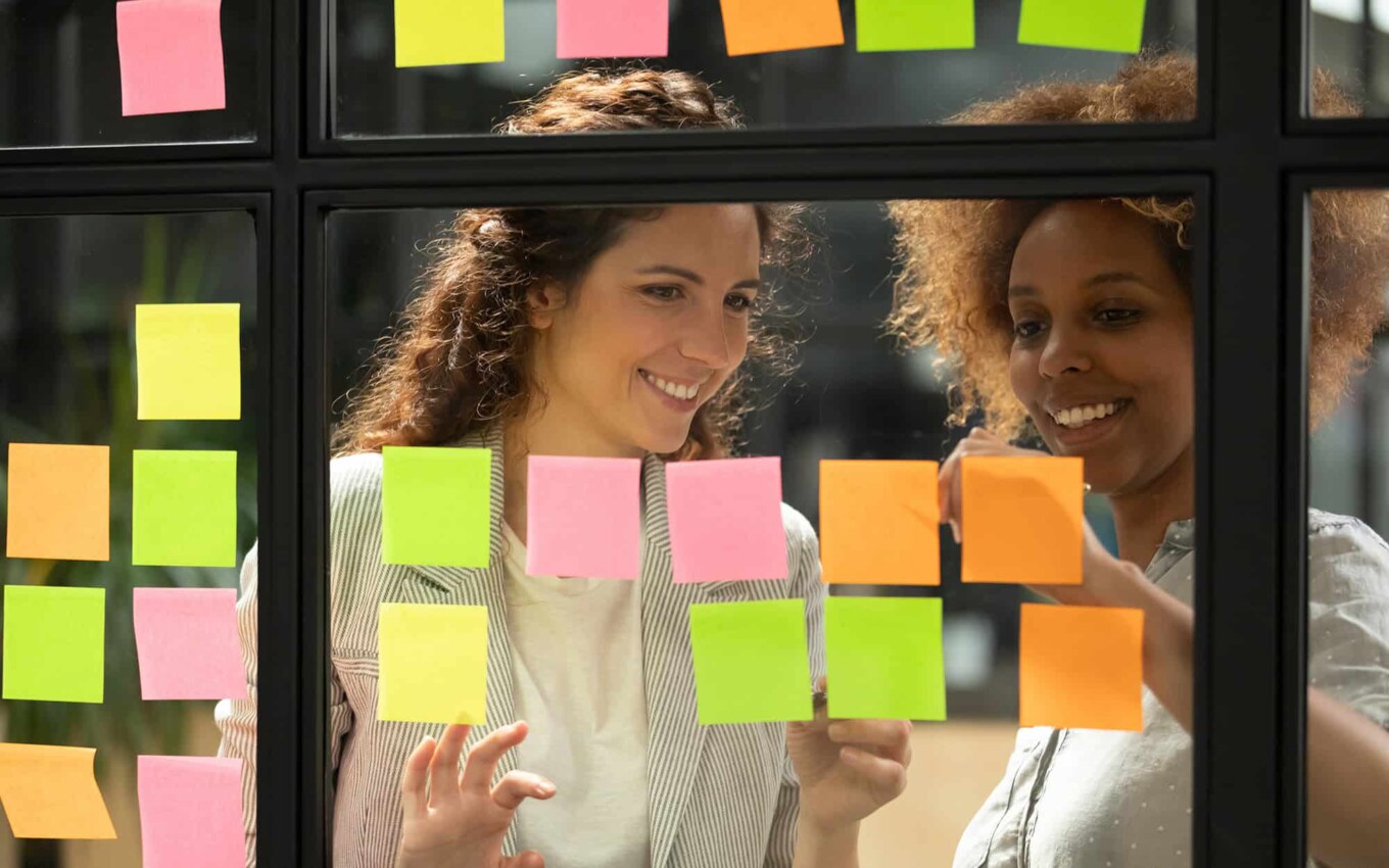 Two coworkers working on project management