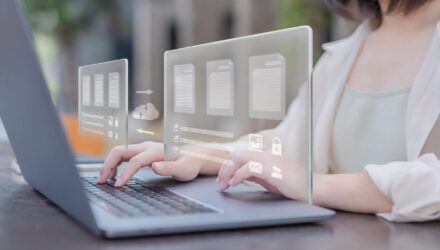 Modern Business Data Management | i3solutions Businesswoman using futuristic digital interface for data management.