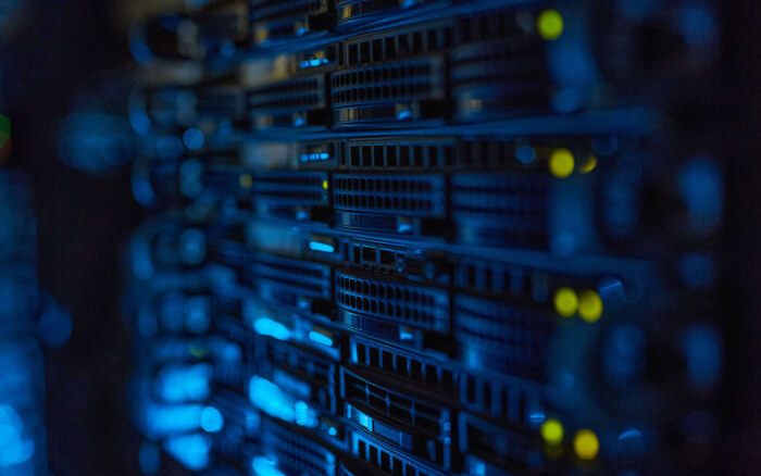 Futuristic background image of rack server with blinking lights in supercomputer