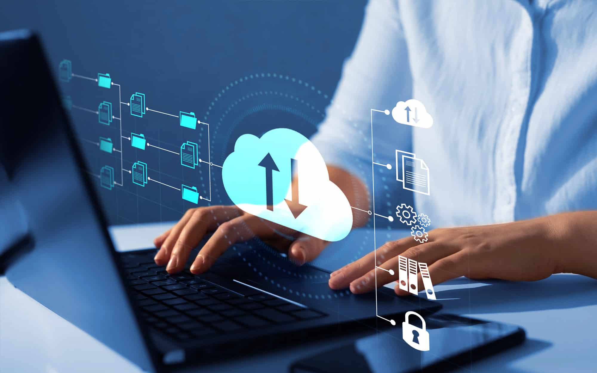 Cloud Data Management and Migration Solutions | i3solutions Cloud data management and migration icons with a person using a laptop.
