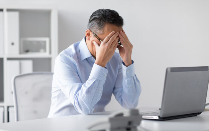 Stressed person at computer