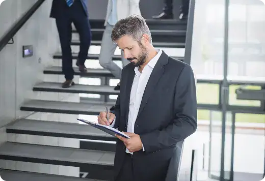 Business Professional Reviewing Documents | i3solutions Enterprise leader reviewing Azure innovation strategy for AI, automation, and analytics initiatives.