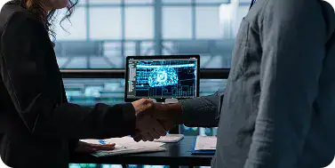 Business Handshake in Tech Office | i3solutions Enterprise IT leaders streamlining Microsoft environments to reduce operational complexity.