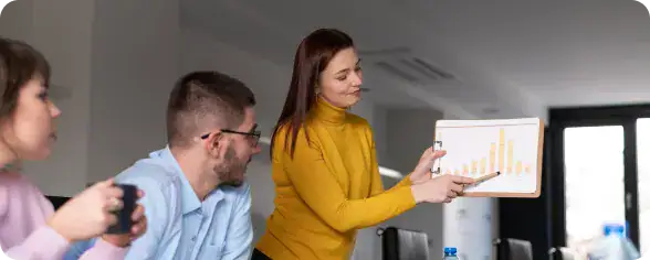 Business Meeting with Data Presentation | i3solutions Enterprise team using Microsoft Copilot insights to improve operational efficiency and workflow automation.