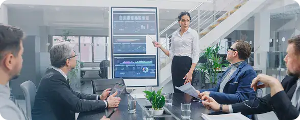 Business Meeting with Data Presentation | i3solutions IT leaders reviewing Microsoft Dataverse integrations with Power Platform, APIs, and external data sources.