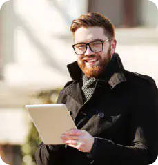 i3solutions Tech Expert with Tablet Consultant reviewing Microsoft environment assessment report on tablet.