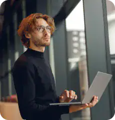 Modern Business Professional Using Laptop Consultant analyzing Microsoft license and utilization data on laptop.