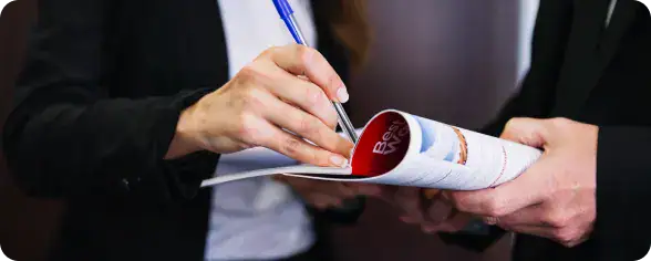 Business Meeting with Document Review | i3solutions Professional submitting a regulatory application through a secure Microsoft Power Pages intake portal.