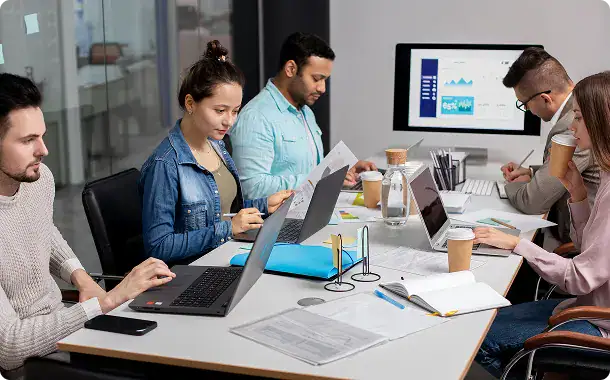 i3solutions Team Meeting in Modern Office | i3solutions Enterprise team collaborating on Microsoft Power Platform solution development and workflow automation.