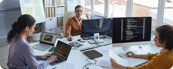 IT Team Collaborating in Modern Office | i3solutions SharePoint developers working on enterprise integration and agile sprint delivery.