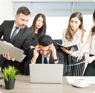 Business Team Overwhelmed at Work | i3solutions Enterprise stakeholders frustrated by fragmented analytics reporting from data silos, inconsistent metrics, and slow reporting cycles.