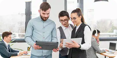 i3solutions Team Collaboration in Office | i3solutions Enterprise IT team reviewing Microsoft Entra ID and device identity configuration for Intune readiness.