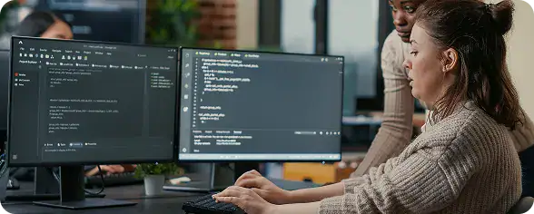 Software Developers Collaborating on Code | i3solutions Team reviewing code and data setup for enterprise LLM retrieval architecture and RAG readiness.