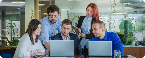 Team Collaboration in Tech Meeting | i3solutions Cross-functional team collaborating on enterprise LLM security, compliance, and risk alignment.