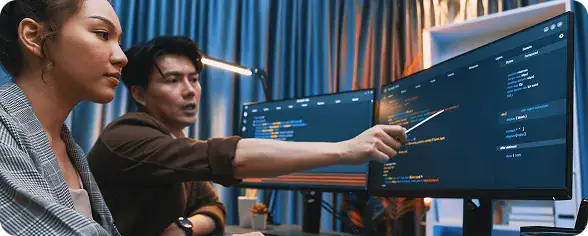 IT professionals working on software development | i3solutions Microsoft-based workflow and process automation connecting enterprise systems with governed automation controls.