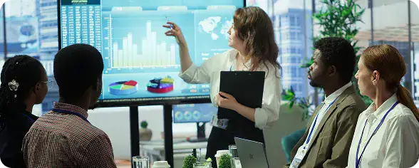 Business Meeting with Data Presentation | i3solutions Cross-functional team collaborating efficiently with access to consistent, accurate information from integrated enterprise systems.