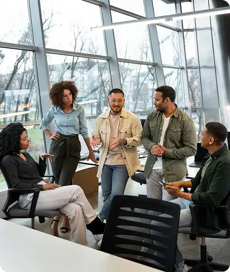Diverse Business Team Meeting in Modern Office | i3solutions Senior consultants advising on Microsoft Intune, conditional access, and endpoint security architecture.
