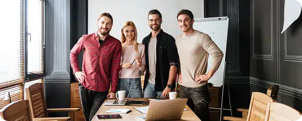 Team of Business Professionals in Meeting Room | i3solutions Cross-functional team collaborating in a unified Microsoft Fabric data workspace environment.