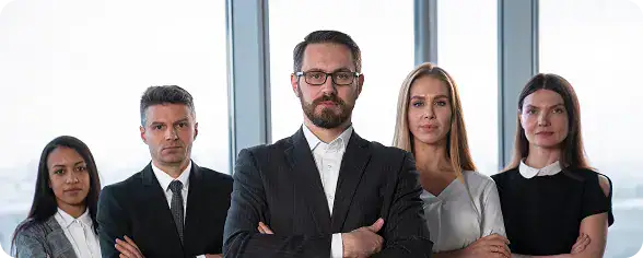 Business Team in Office Setting | i3solutions Business professionals standing in a modern office setting for enterprise SharePoint architecture review.