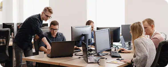 Team Collaboration in Office Setting | i3solutions Consultants aligning SharePoint governance and compliance architecture.