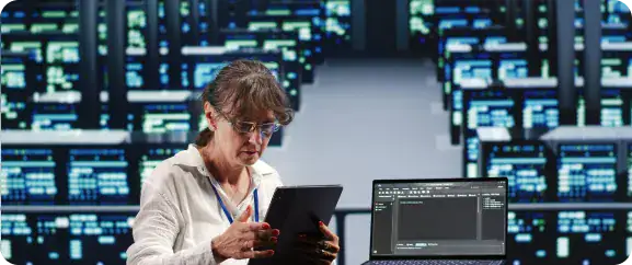 Data Center Technician Using Tablet | i3solutions Enterprise cloud architect managing scalable infrastructure across Microsoft Azure and hybrid cloud environments
