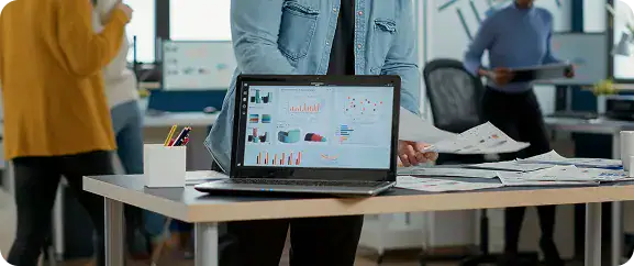 Business Team Collaborating on Data Analysis | i3solutions Enterprise information sprawl across Microsoft 365, ServiceNow, Jira, and email driving duplication and slow decision-making