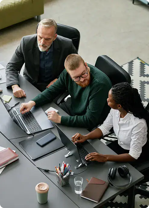 Web Application Development Team Meeting | i3solutions Enterprise team reviewing web application architecture and modernization strategy during a collaborative planning session