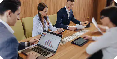 Business Meeting for Web App Development | i3solutions Enterprise team analyzing web application performance and scalability requirements during a technical planning session