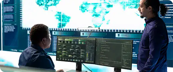 Governance & Compliance Solutions Overview | i3solutions IT professional evaluating governance controls across enterprise platform dashboards