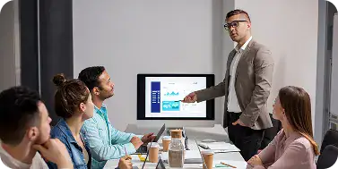 Business Meeting with Data Presentation | i3solutions Increasing executive confidence in Microsoft enterprise investments through defensible architectures and traceable outcomes