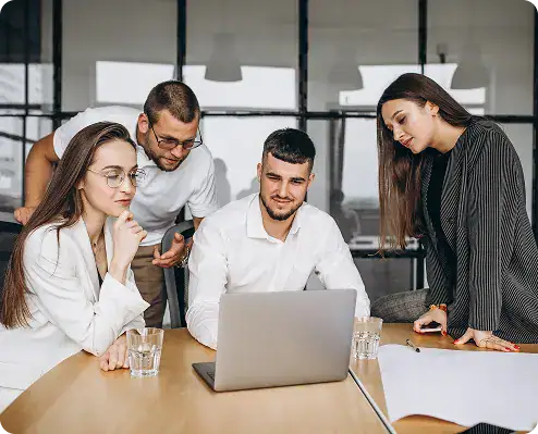 Senior cloud specialists collaborating on Microsoft cloud-native application architecture in an enterprise environment