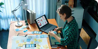 Web App Development Team at Work | i3solutions Developer building responsive web application interfaces across multiple devices and screen formats
