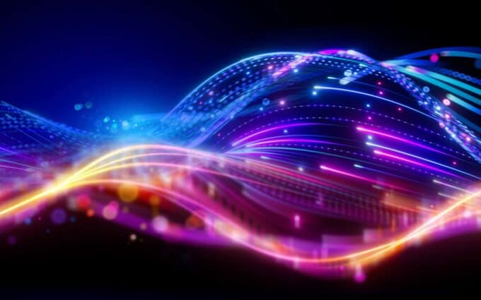 Futuristic digital data waves with vibrant neon lights and flowing lines, representing technology an.