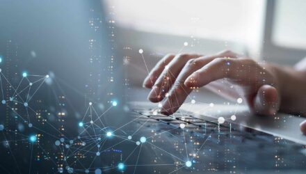 Innovative Technology Solutions | i3solutions Hands typing on a keyboard with digital network overlay, representing tech innovation.
