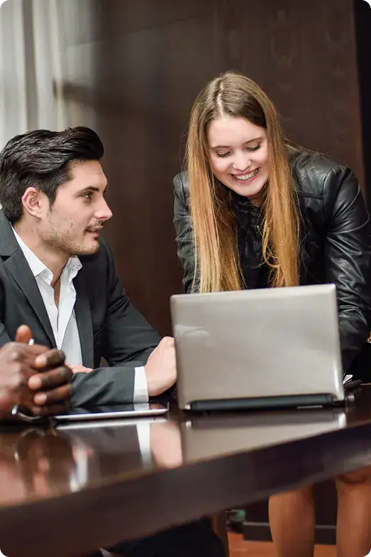Professional Business Meeting with Laptop | i3solutions Dynamics 365 developers collaborate on an enterprise augmentation engagement requiring platform governance and senior technical delivery.