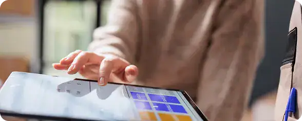 Businesswoman Using Digital Tablet | i3solutions Integration and automation enablement across Microsoft integration services, Power Automate, and Azure.