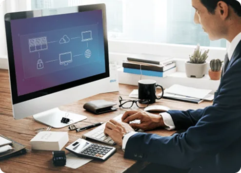 Enterprise Migration Services Office Setup | i3solutions Business professional working on cloud migration on desktop computer.