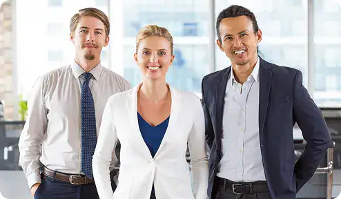 Business Team in Modern Office | i3solutions Senior-led modernization delivery focused on risk control, governance, and operational stability.