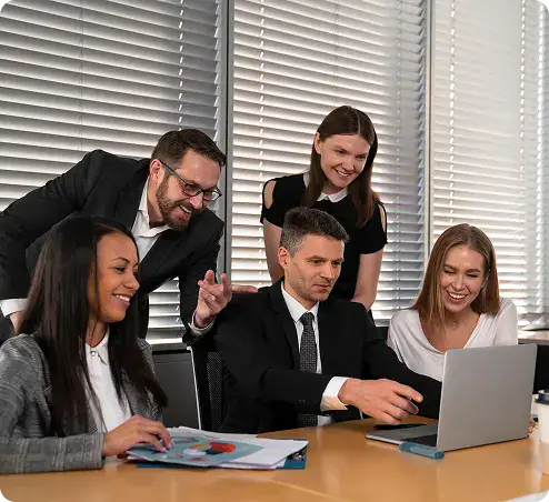 Team Collaboration for Microsoft Solutions | i3solutions Business team collaborating on a Microsoft project in an office setting.