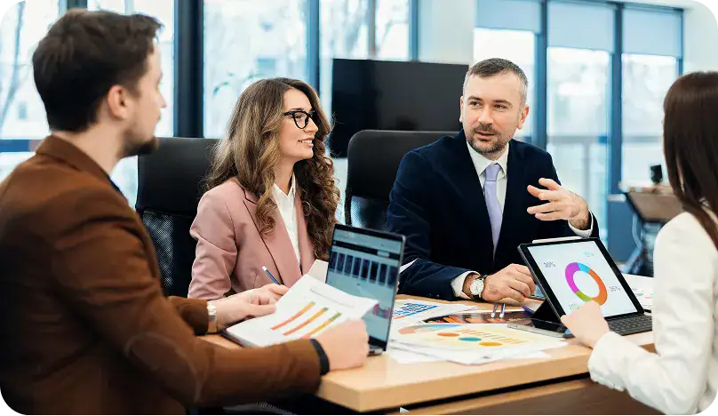 Business Meeting for Post-Implementation Support | i3solutions Team discussing post-implementation support strategies in a modern office.