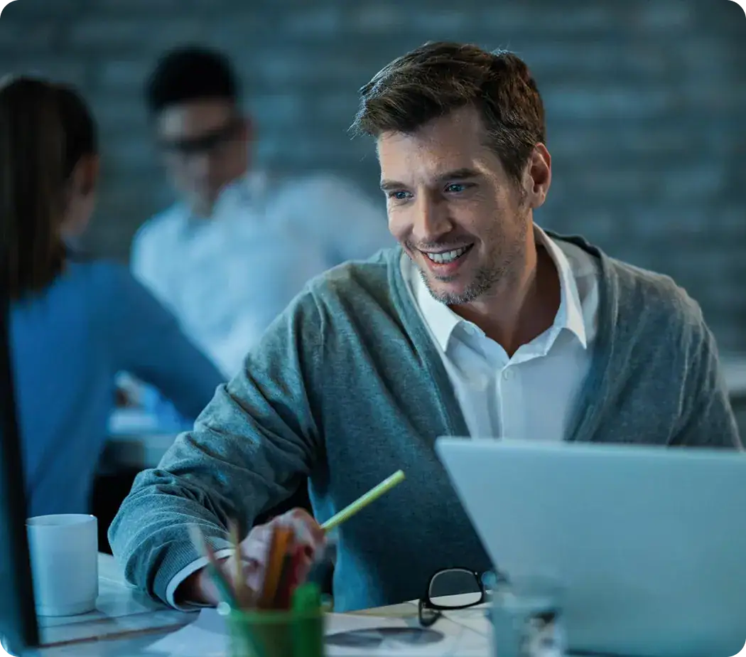 Business Meeting with AI Focus | i3solutions Professional man smiling during a business meeting about AI solutions.
