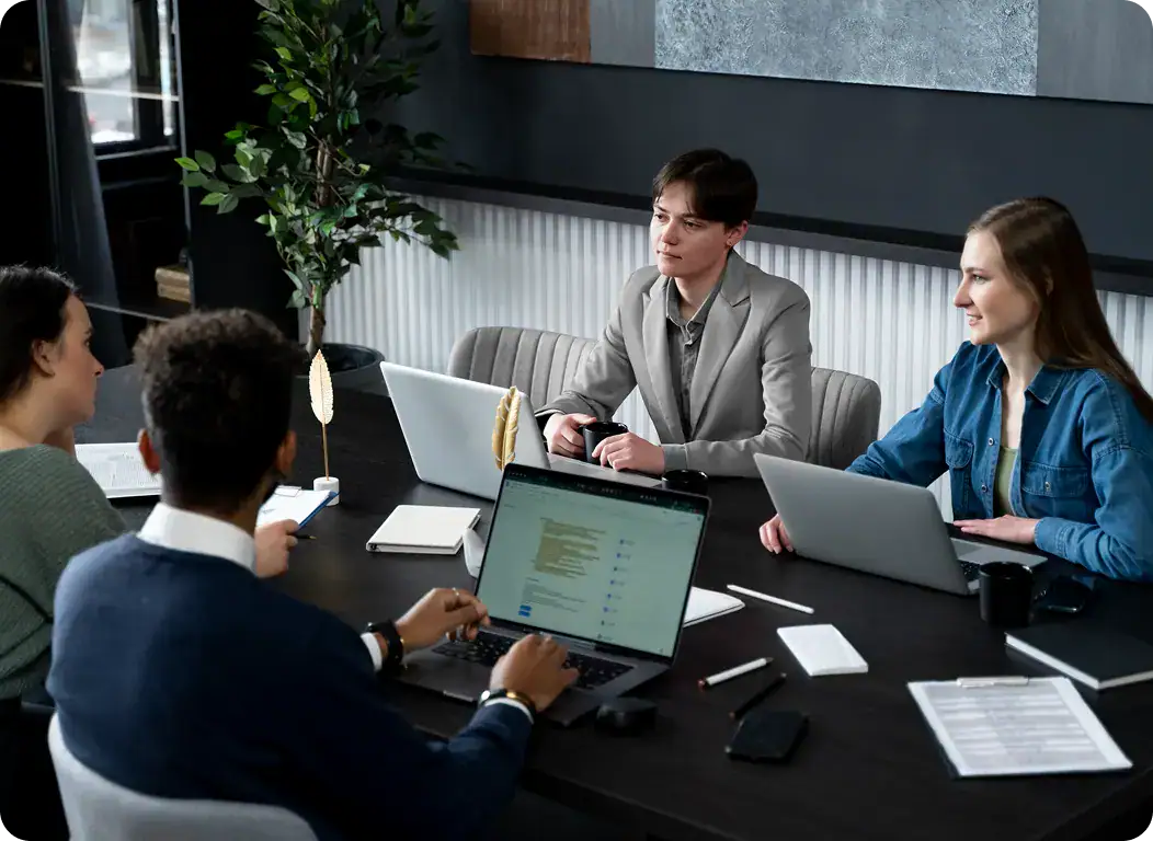 Business Meeting for Data Analytics Services | i3solutions Team of professionals discussing data fusion and predictive analytics strategies.