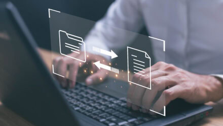 Digital file transfer and document management concept on a laptop screen.